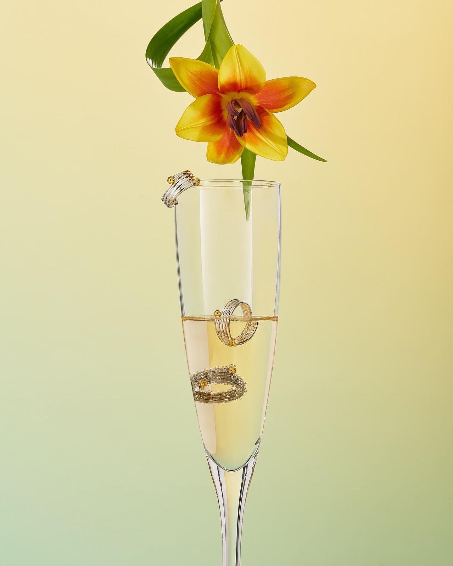 Champagne glass with jewelry and flower - Tous 2022 Cocktail Campaign - Set Design by Maria Ona